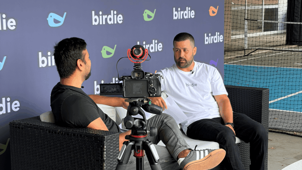 Baber Zaka, General Manager, Third Party Banking at CommBank, being interviewed near the pickleball court at Inspire Cowork.