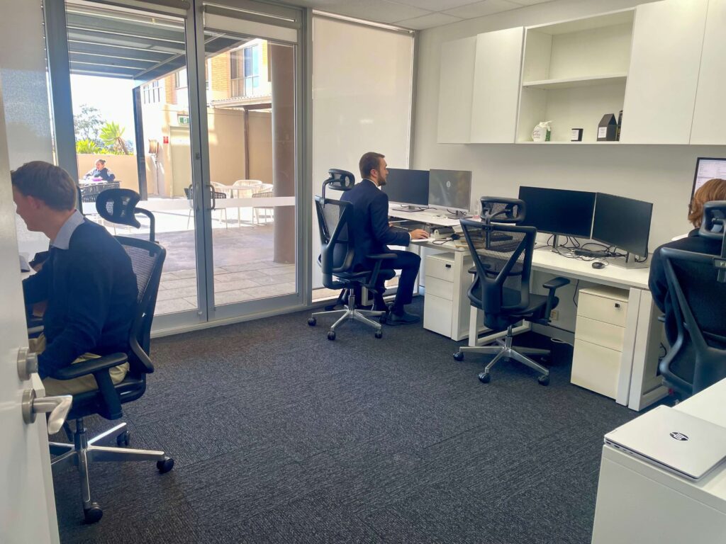 Juye, Ben and Jacob working in StewartBrown’s ground floor office at Inspire Cowork Miranda.