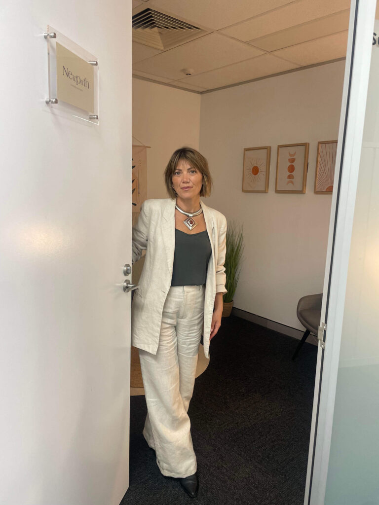 Sandra Moscardo standing in the doorway of her consulting room at Inspire Cowork Miranda.